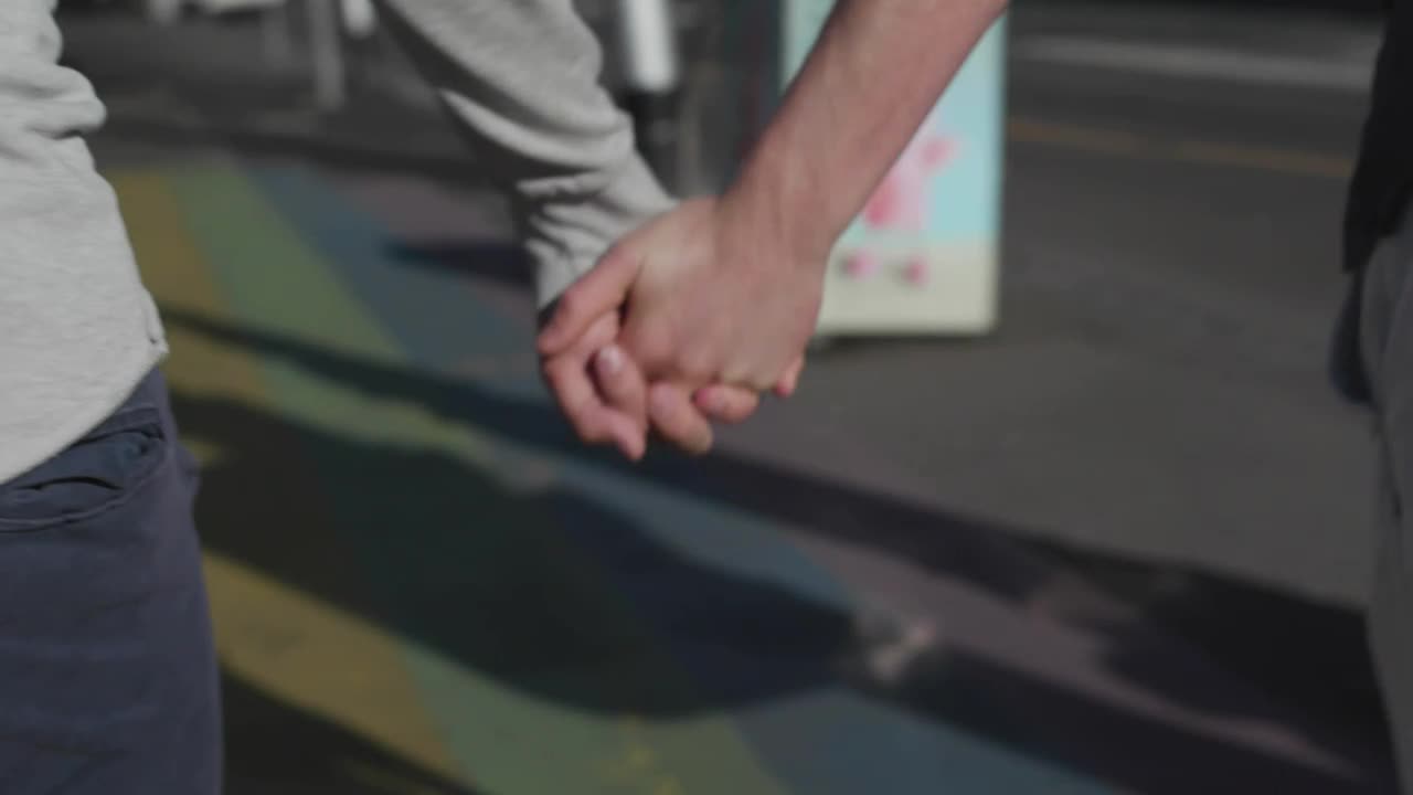 Stock Video Holding Hands Over Rainbow Crosswalk Animated Wallpaper