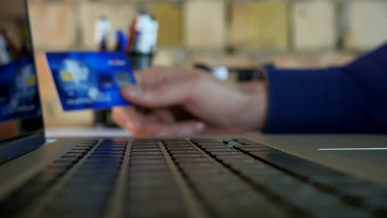 Stock Video Holding Credit Card And Typing On A Keyboard Animated Wallpaper