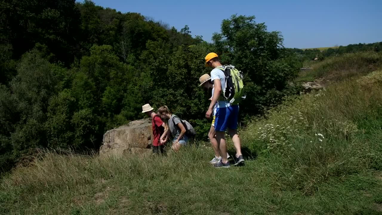 Stock Video Hikers Moving Down A Steep Path Animated Wallpaper