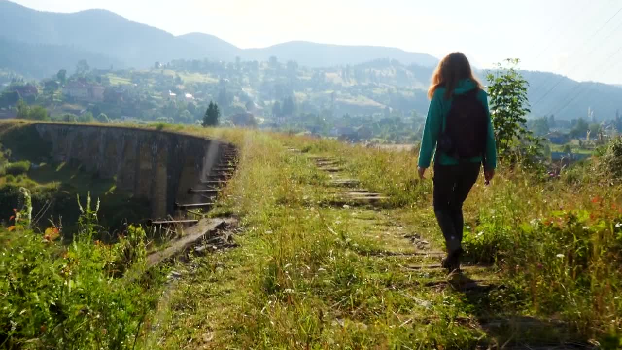 Stock Video Hiker Woman Walking Through An Ancient Route Path Animated Wallpaper