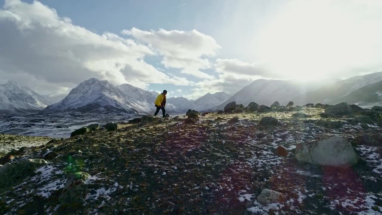 Stock Video Hiker Walking On A Hilly Landscape Animated Wallpaper
