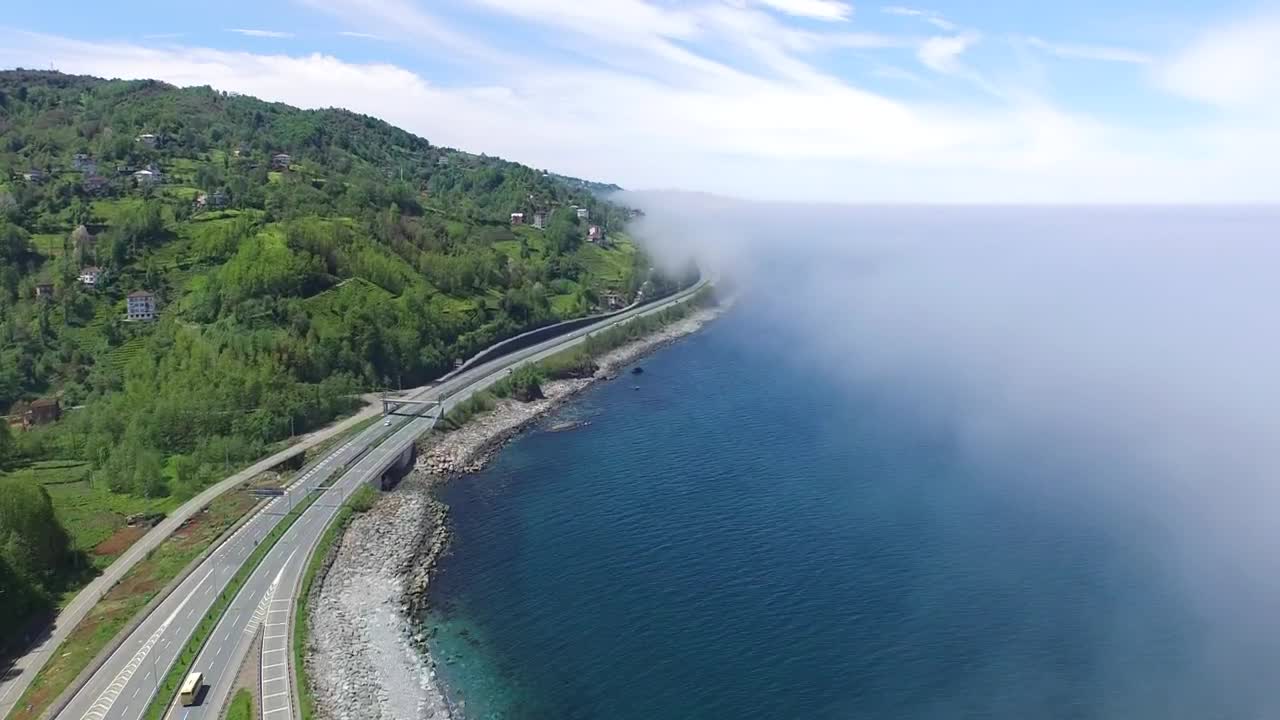 Stock Video Highway Road Between The Blue Ocean And The Forest Animated Wallpaper