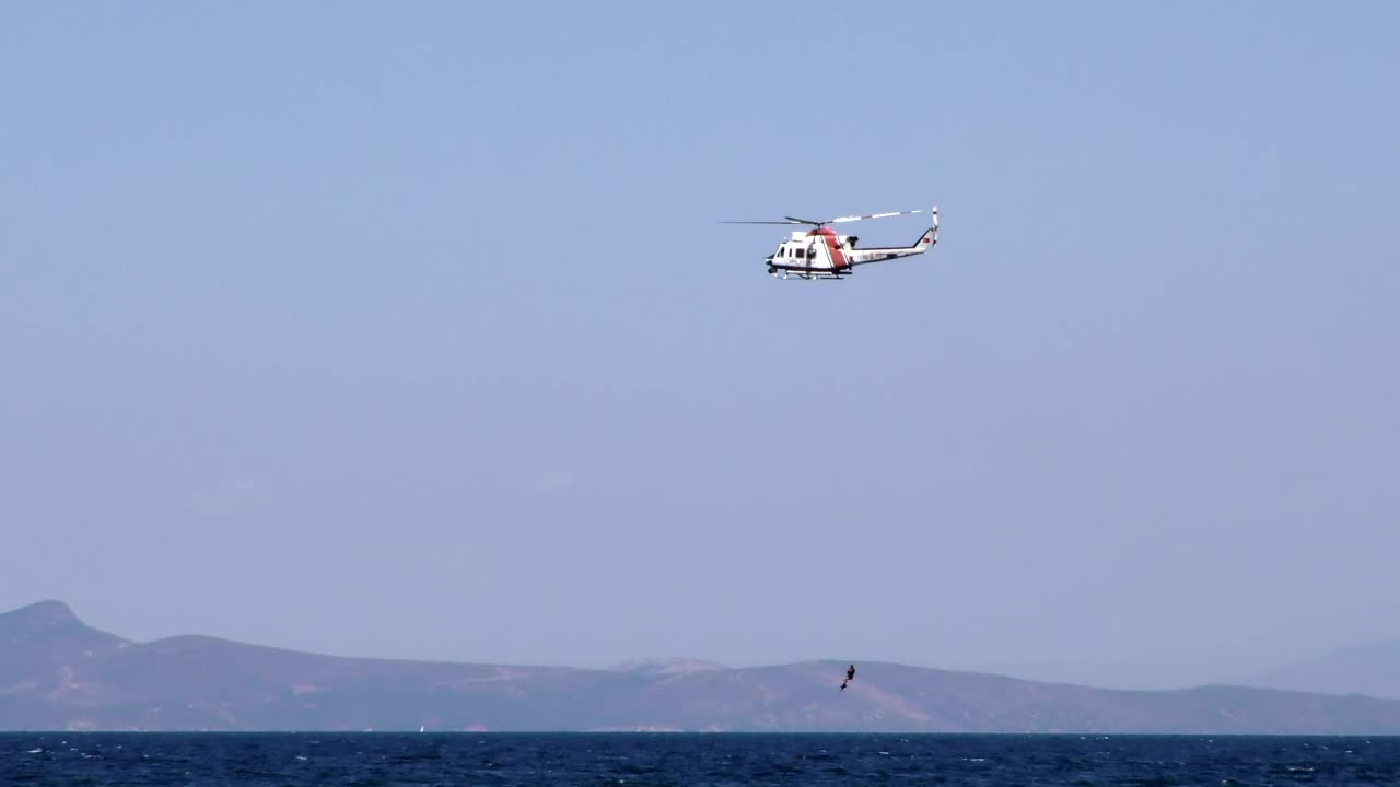 Stock Video Helicopter Rescuing Diver From The Sea Animated Wallpaper