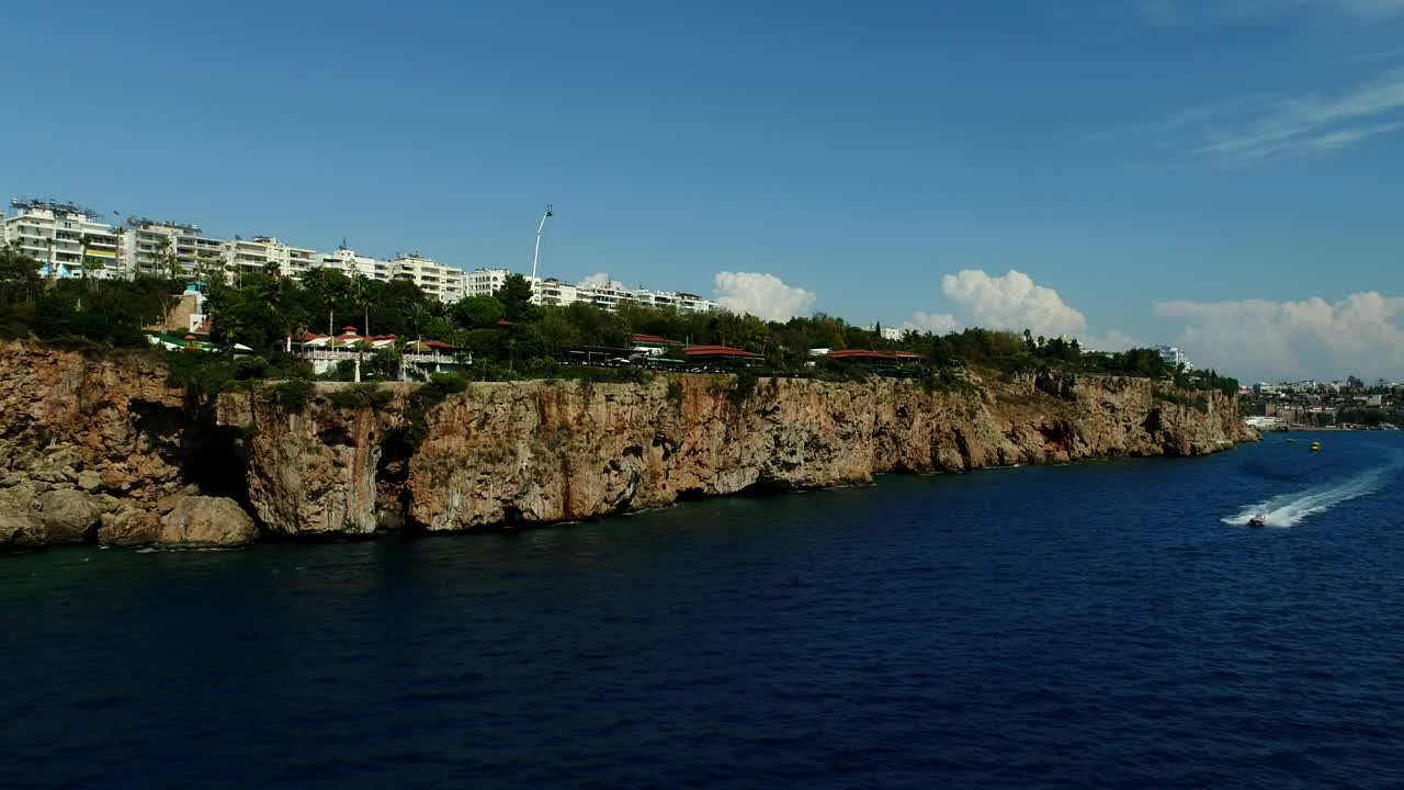 Stock Video Helicopter Racing A Boat Along The Coast Animated Wallpaper