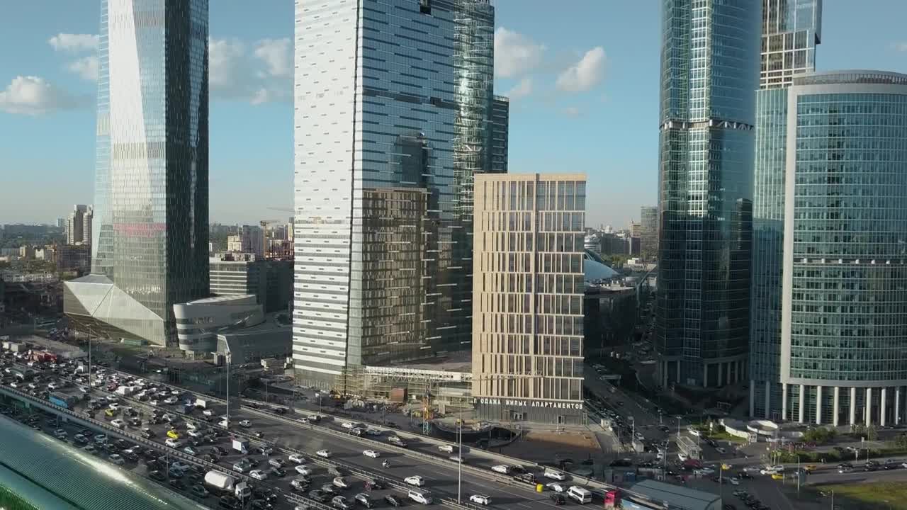 Stock Video Heavy Traffic Heading By Skyscrapers Animated Wallpaper