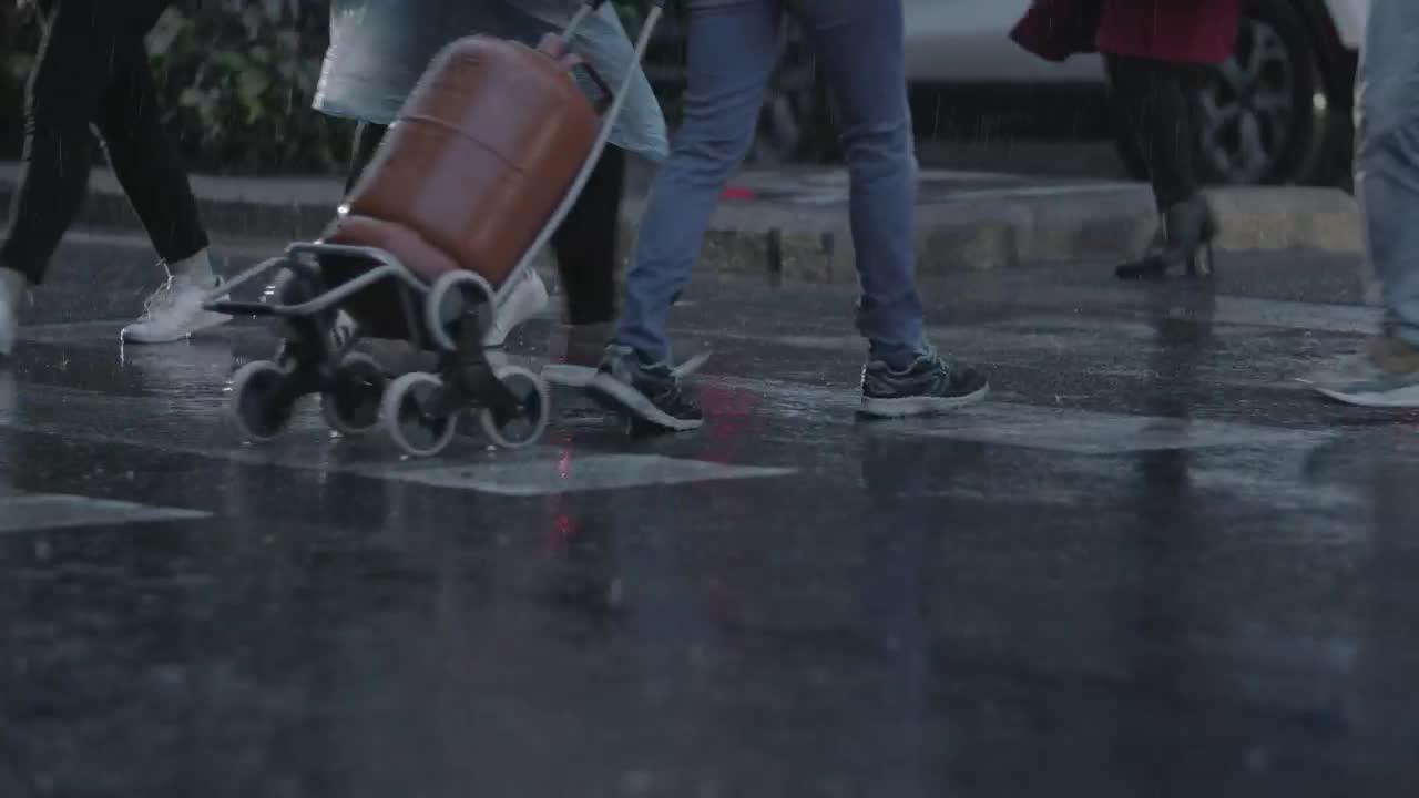 Stock Video Heavy Rain As People Walk Across Town Animated Wallpaper