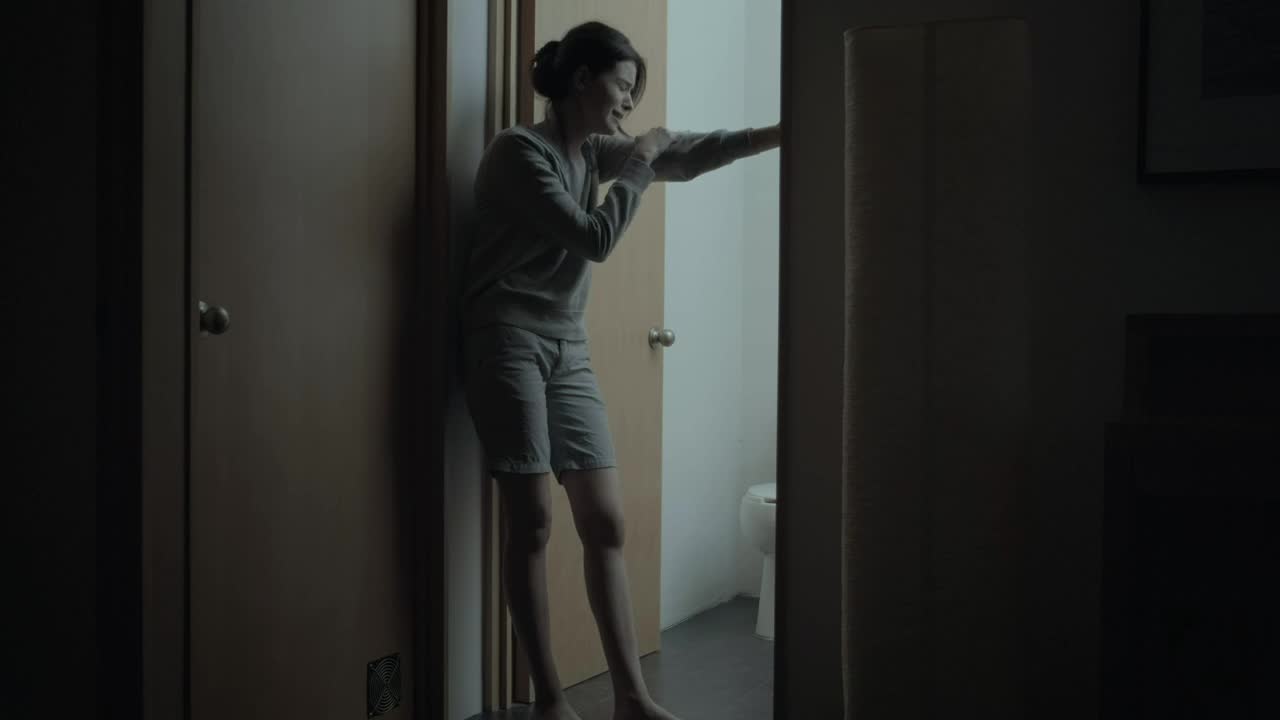 Stock Video Heartbroken Crying Woman Slowly Sits On The Floor Animated Wallpaper