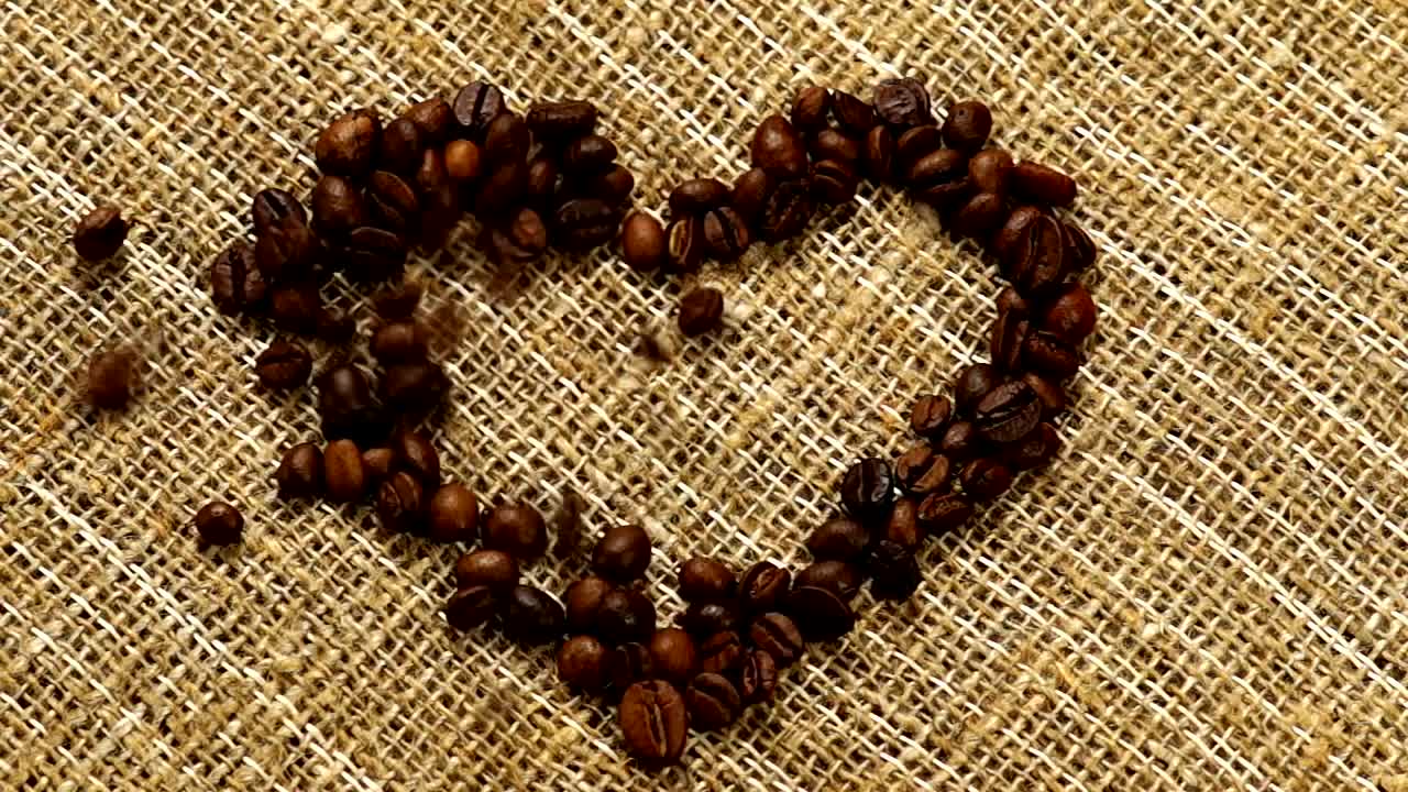 Stock Video Heart Of Coffee Filled With Coffee Beans On A Sack Animated Wallpaper