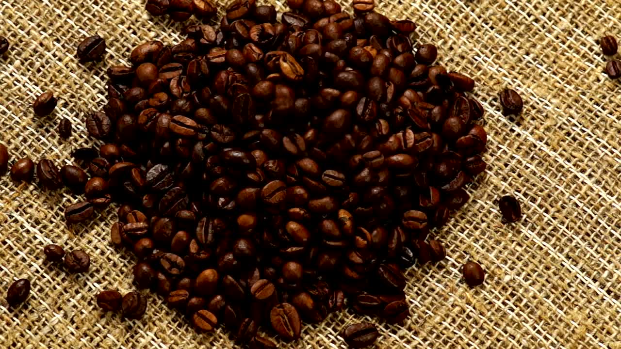 Stock Video Heart Of Coffee Beans On A Natural Fabric Animated Wallpaper