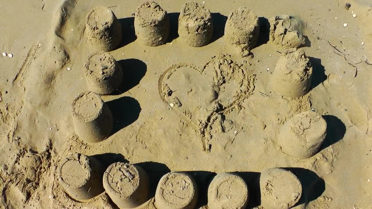 Stock Video Heart In The Sand By The Sea Animated Wallpaper