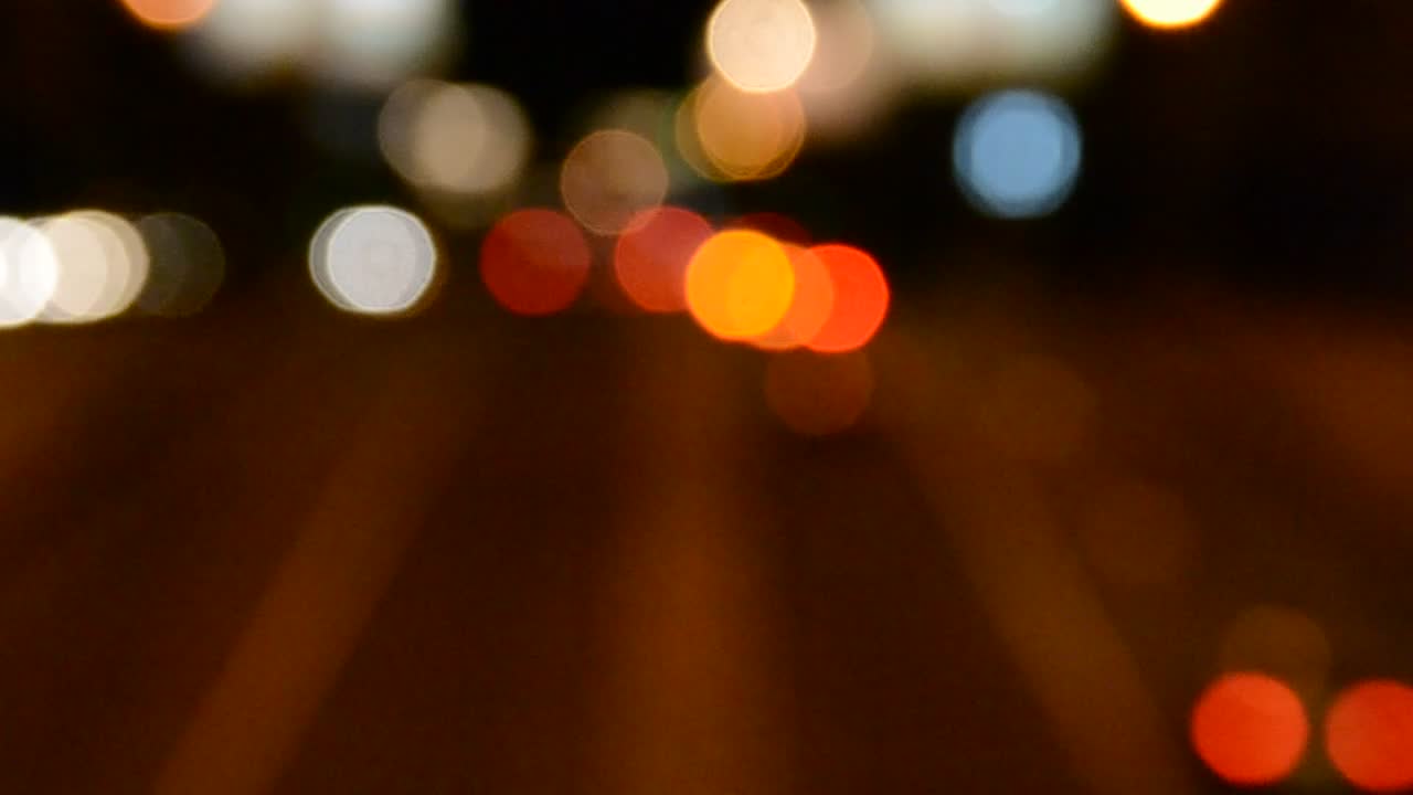 Stock Video Headlights Out Of Focus Against The Night Animated Wallpaper