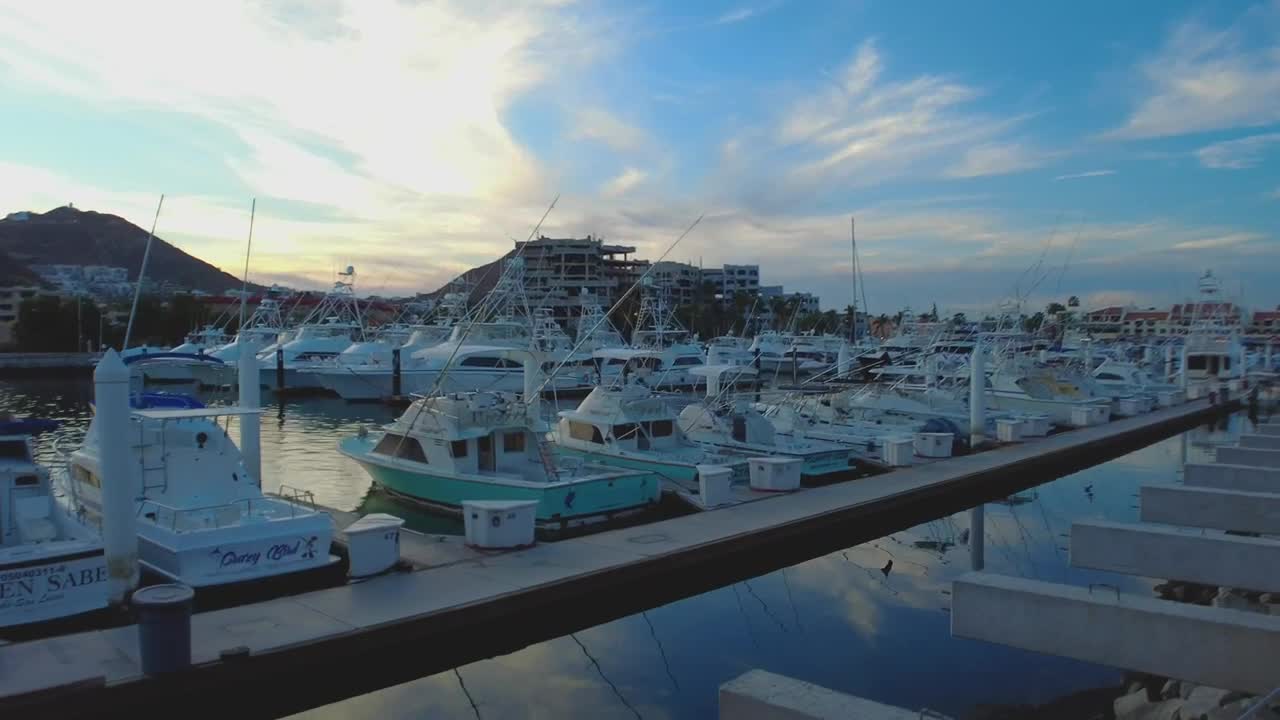 Stock Video Harbor Full Of Boats And Sailboats On A Paradisiacal Coast Animated Wallpaper