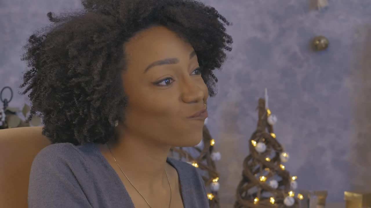 Stock Video Happy Young Woman During A Christmas Dinner Animated Wallpaper