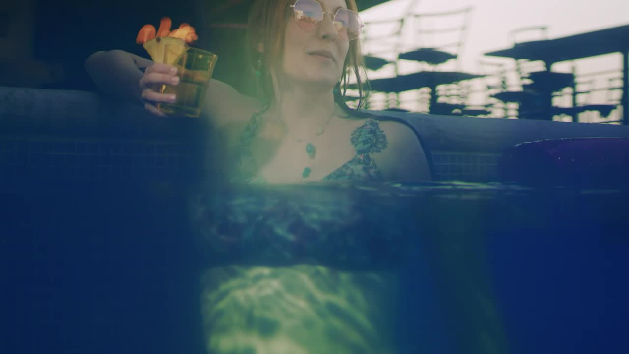 Stock Video Happy Young Woman Enjoying A Cocktail In The Pool Animated Wallpaper