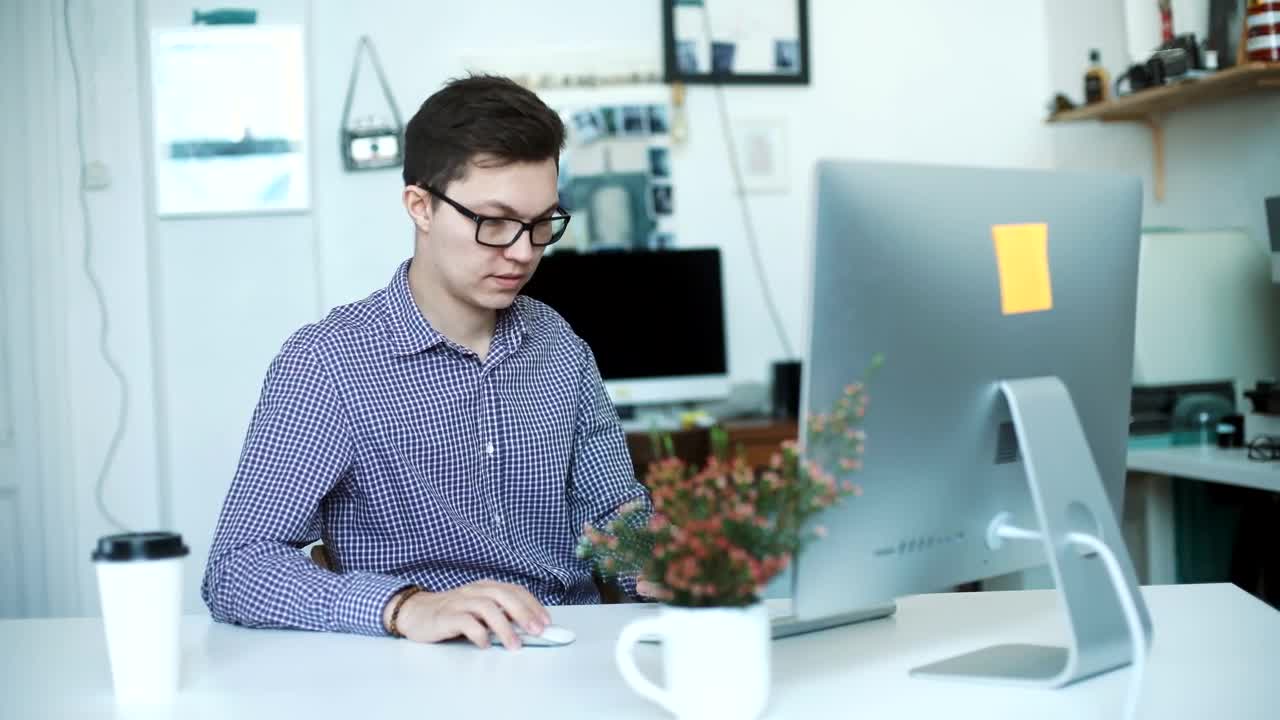Stock Video Happy Young Businessman Working From Home Animated Wallpaper
