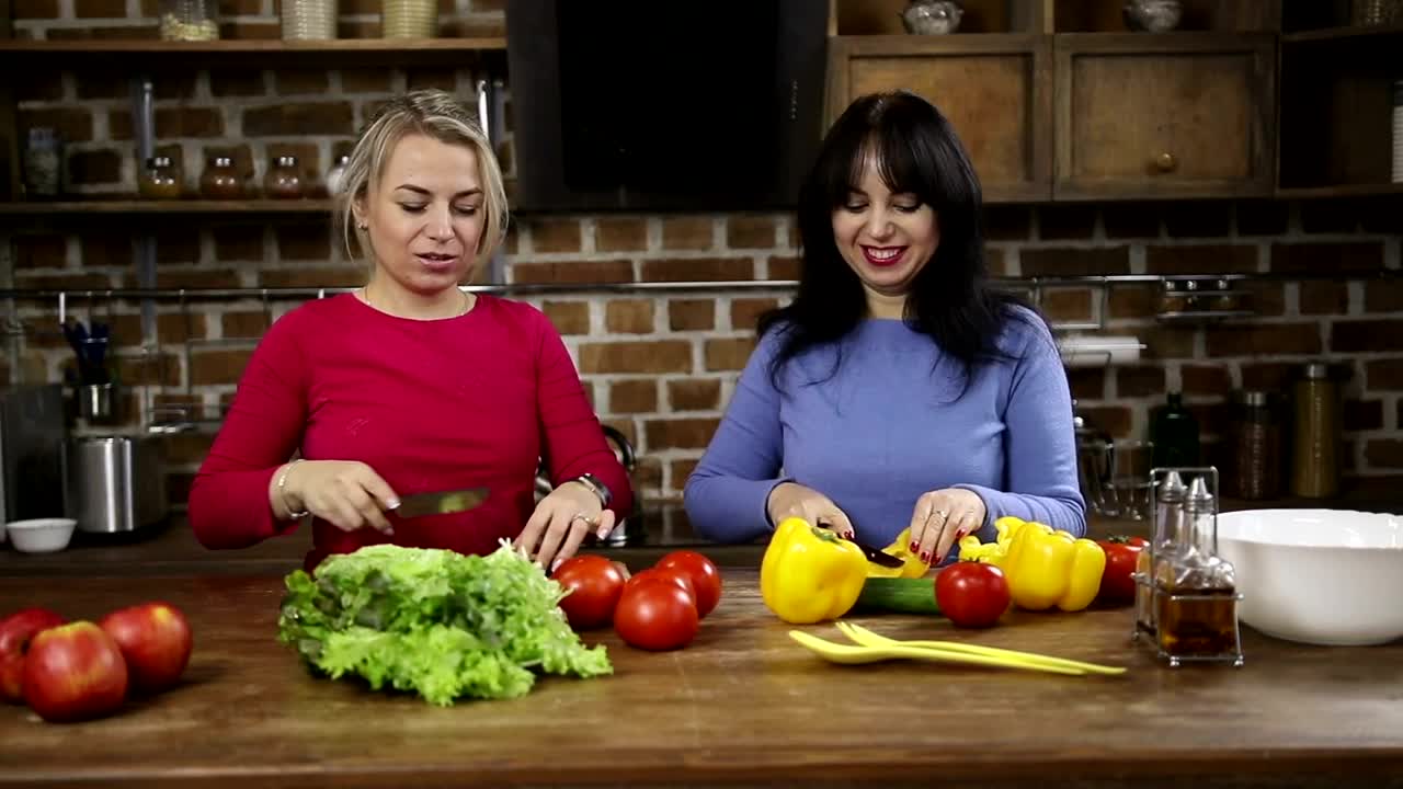 Stock Video Happy Women Cutting Vegetables At Home Animated Wallpaper