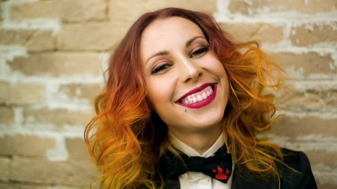 Stock Video Happy Woman Wearing Dress And Black Bow Tie Animated Wallpaper