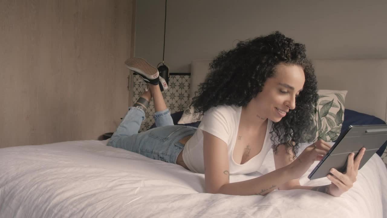 Stock Video Happy Woman Talking On Video Call On A Tablet Animated Wallpaper