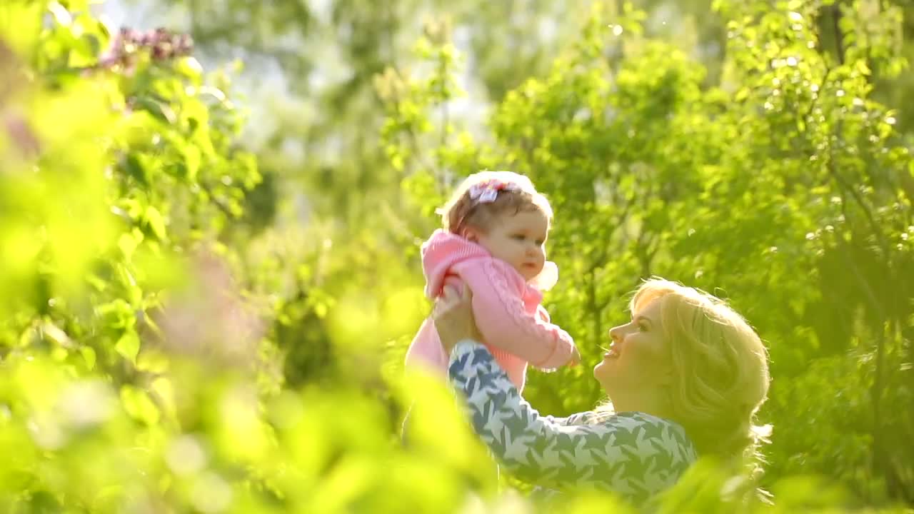 Stock Video Happy Woman Throws Her Daughter In The Air Animated Wallpaper