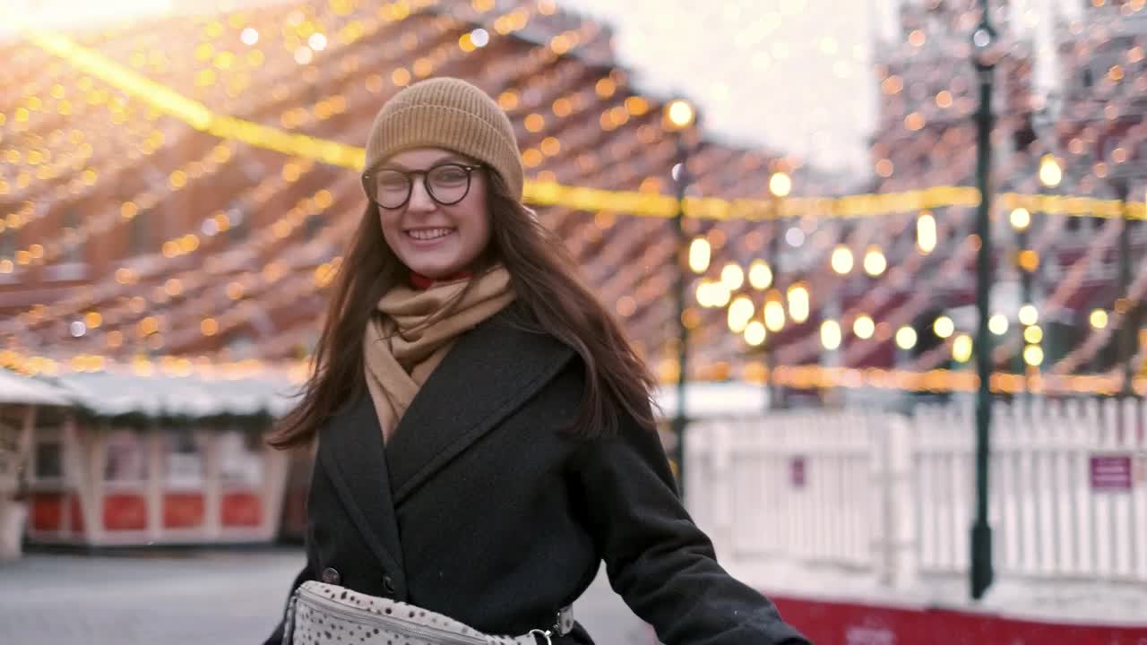 Stock Video Happy Woman Stands On The City Downtown At Christmas Animated Wallpaper