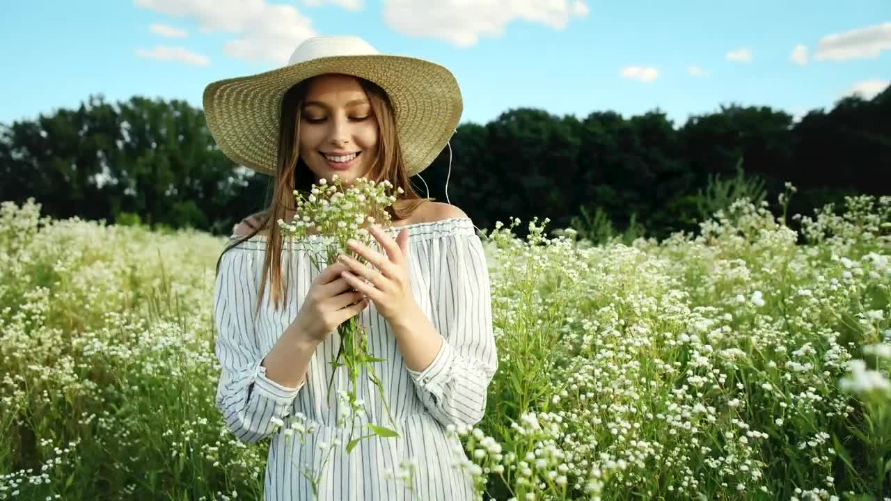 Stock Video Happy Woman In A Flower Field Animated Wallpaper