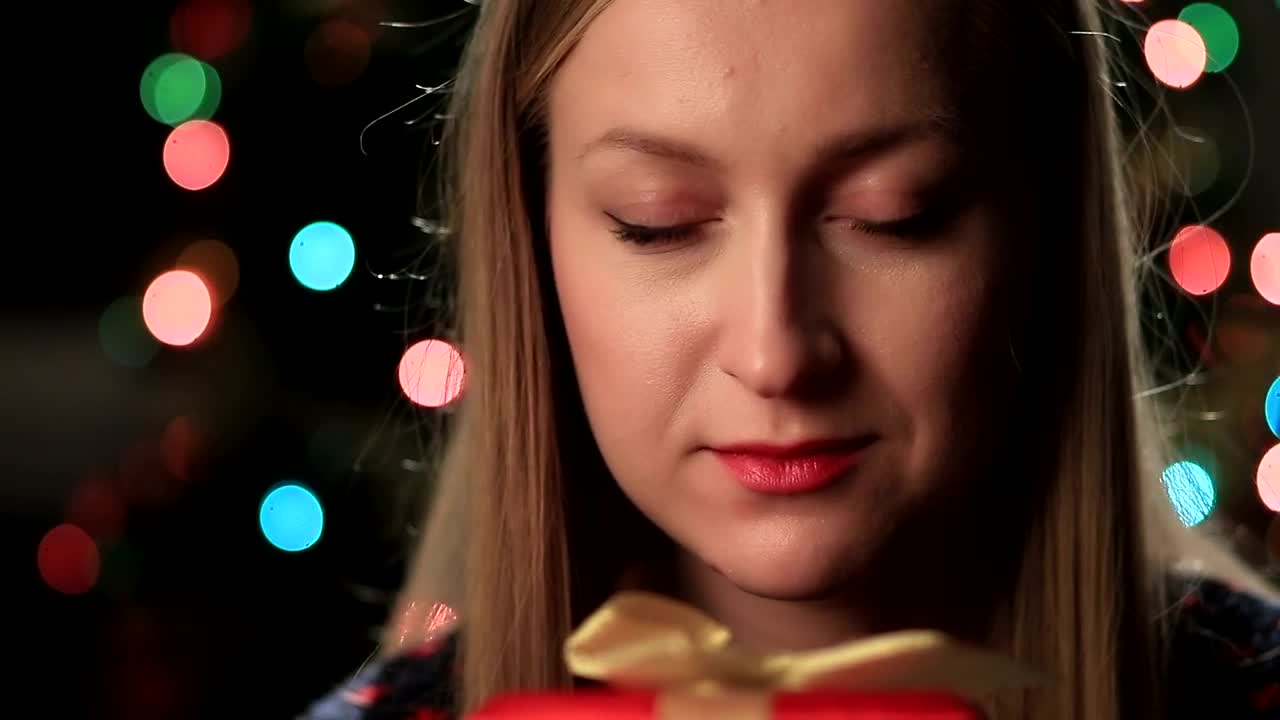 Stock Video Happy Woman Holding A Gift Animated Wallpaper