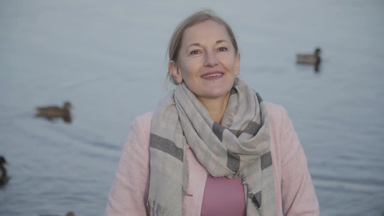Stock Video Happy Woman Breathing In Fresh Air At Duck Pond Animated Wallpaper