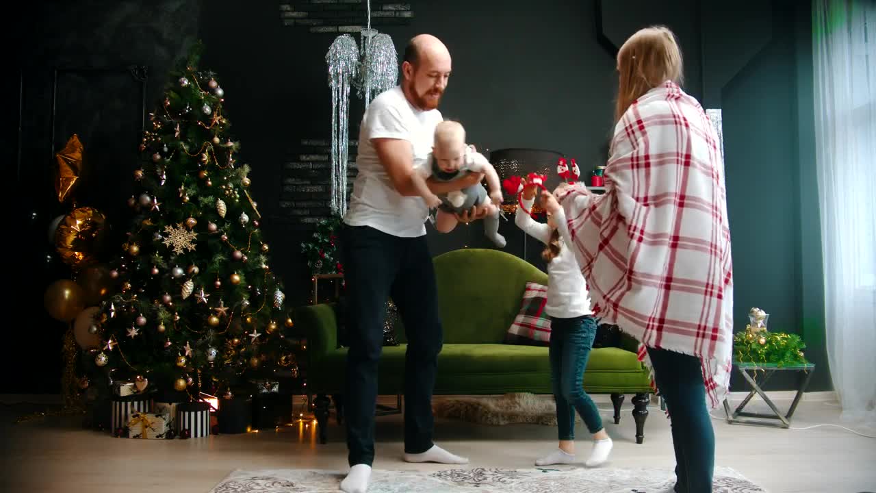 Stock Video Happy Parents Play With Their Daughters At Christmas Animated Wallpaper