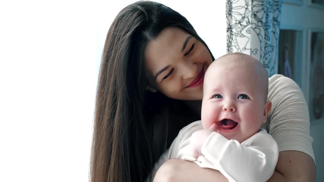 Stock Video Happy Mother Hugging Her Baby Animated Wallpaper