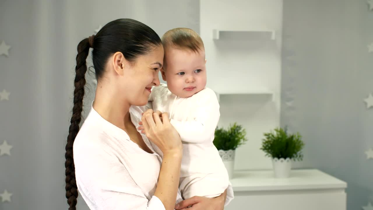 Stock Video Happy Mother Holding Her Little Baby In Arms Animated Wallpaper