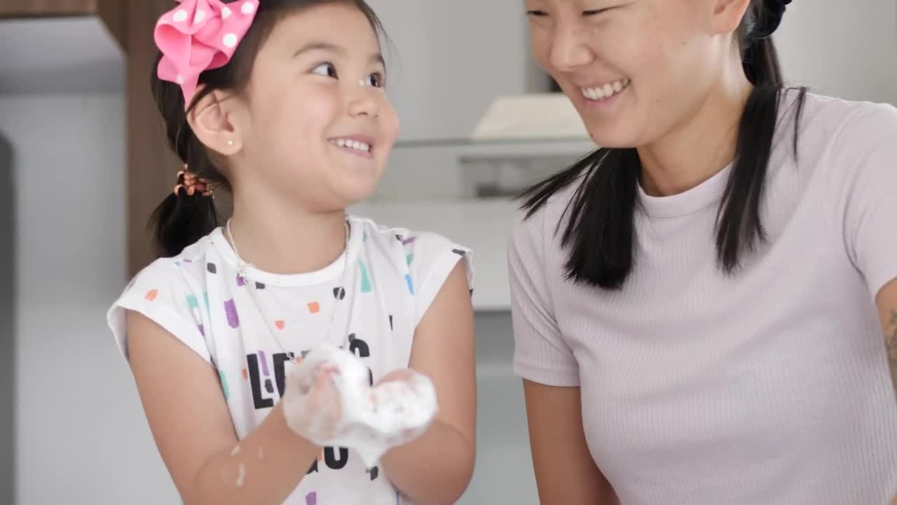 Stock Video Happy Mother And Daughter Cleaning Their House Animated Wallpaper