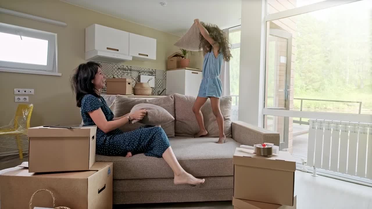 Stock Video Happy Mom And Daughter Playing With Pillows Animated Wallpaper