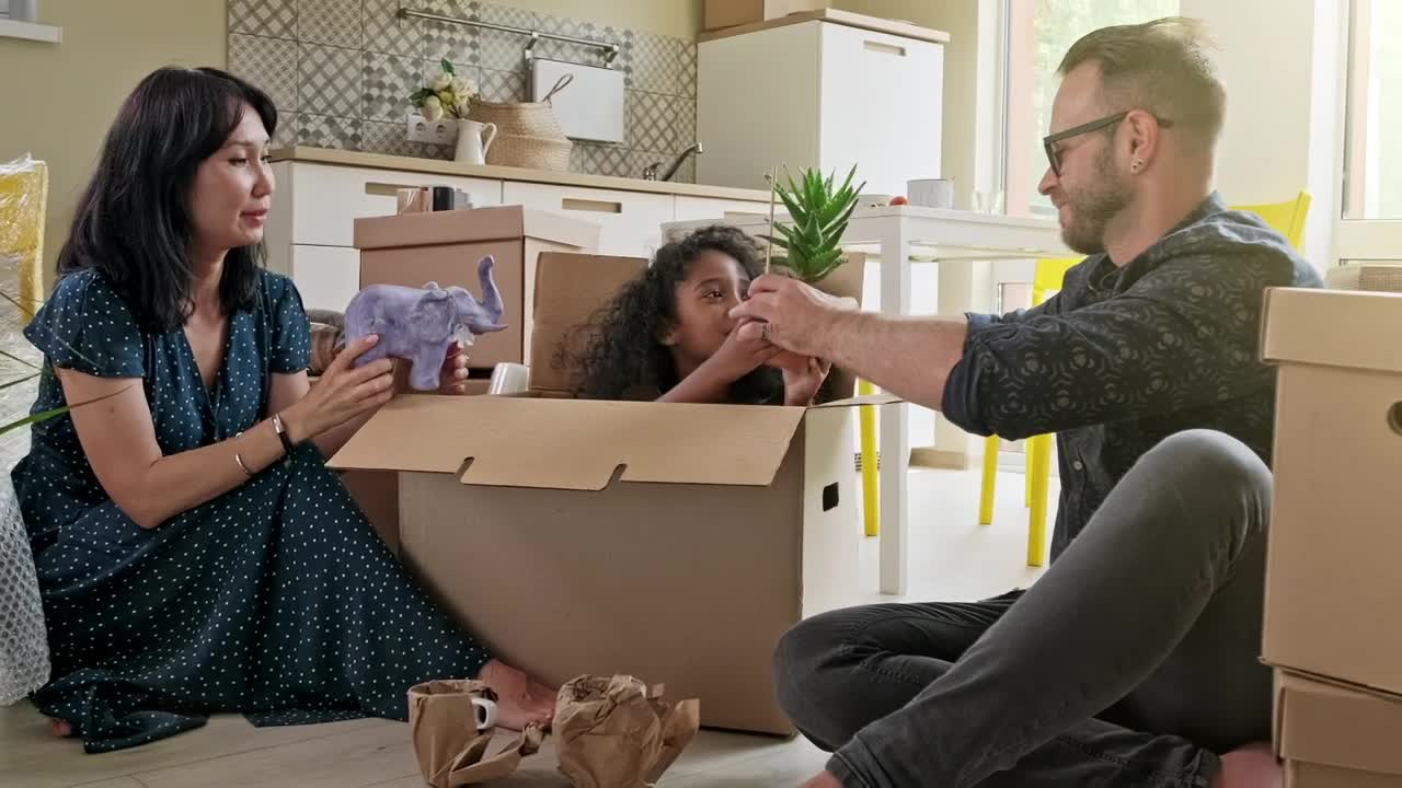 Stock Video Happy Mixed Ethnicity Family Unpacking Boxes Animated Wallpaper