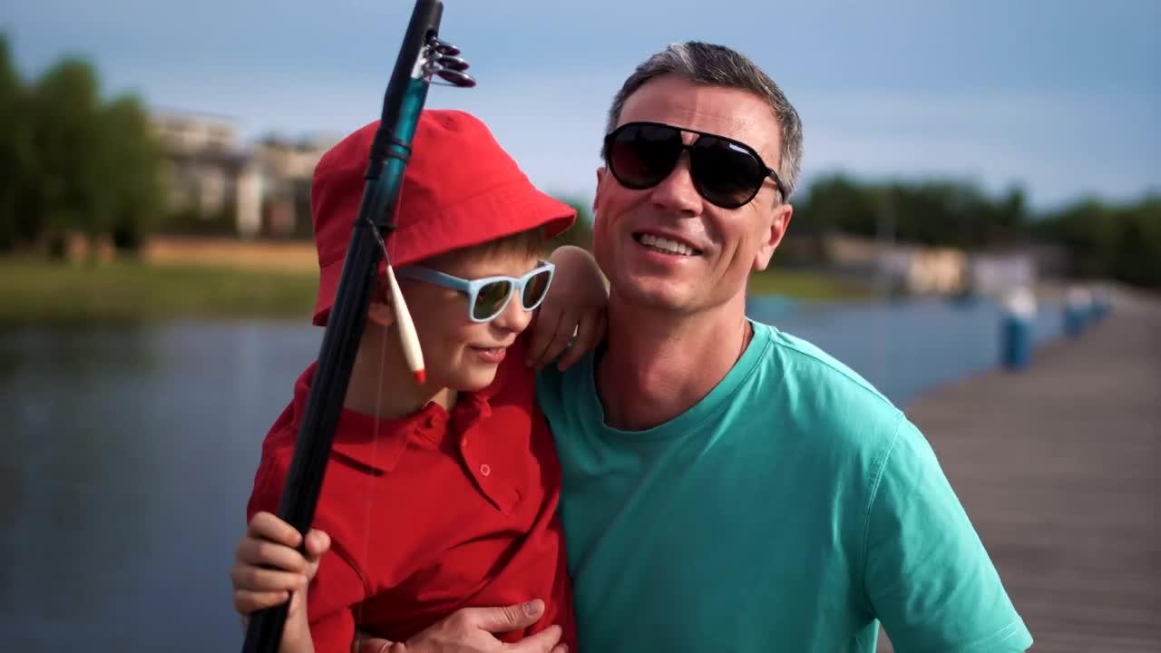 Stock Video Happy Man With His Son On The Pier Animated Wallpaper