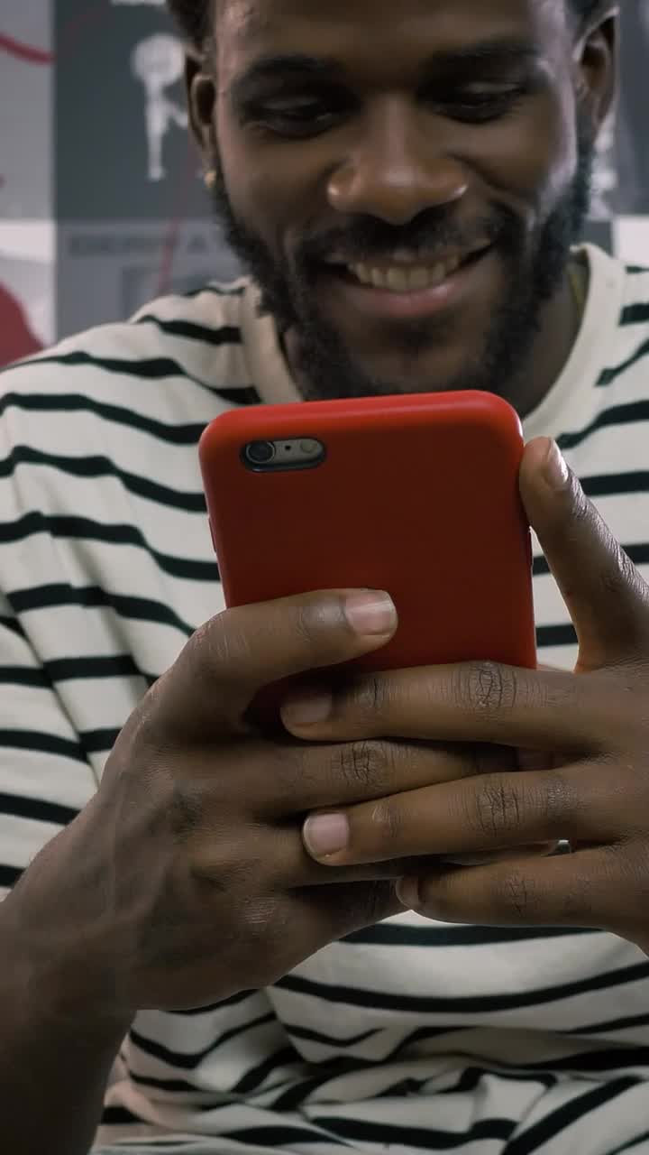 Stock Video Happy Man Texting On His Smartphone Animated Wallpaper