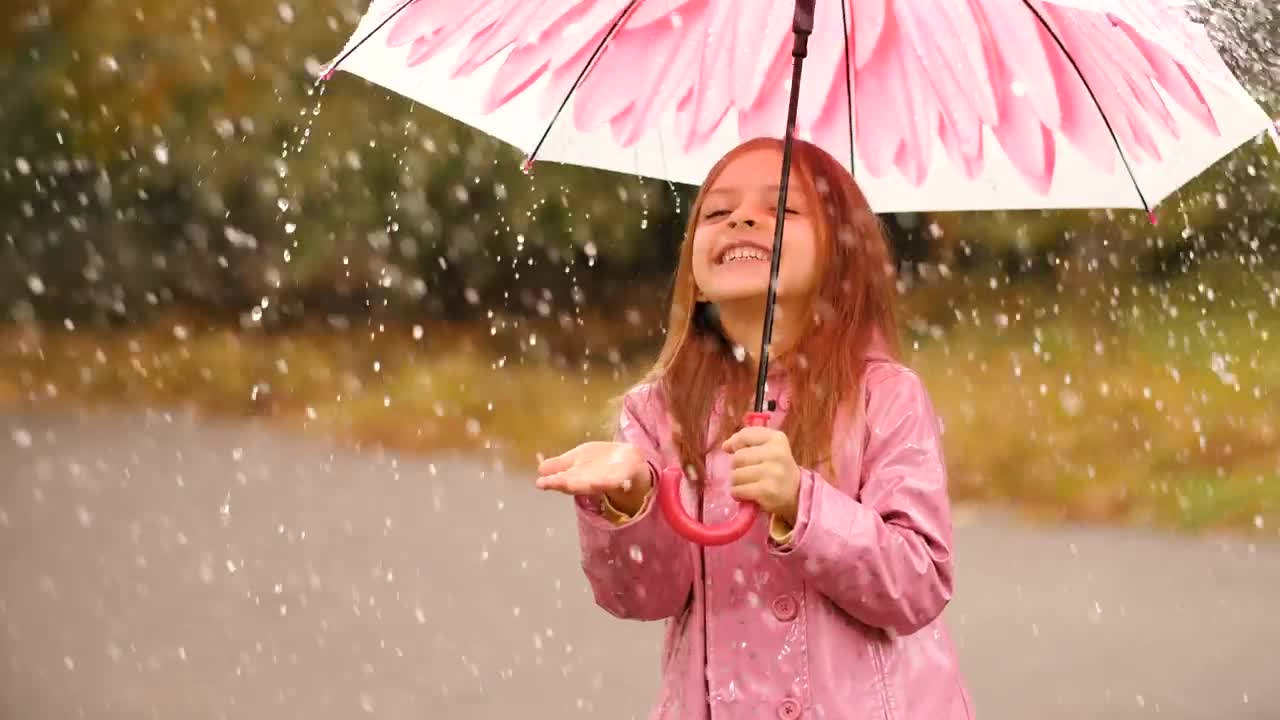 Stock Video Happy Girl With An Umbrella In The Rain Animated Wallpaper