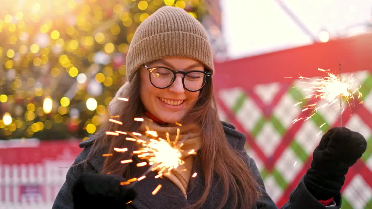Stock Video Happy Girl Holding Sparkles At Christmas Animated Wallpaper