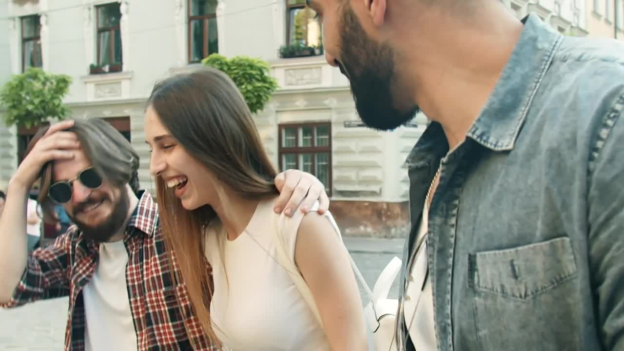 Stock Video Happy Friends Walking Down The Street Animated Wallpaper