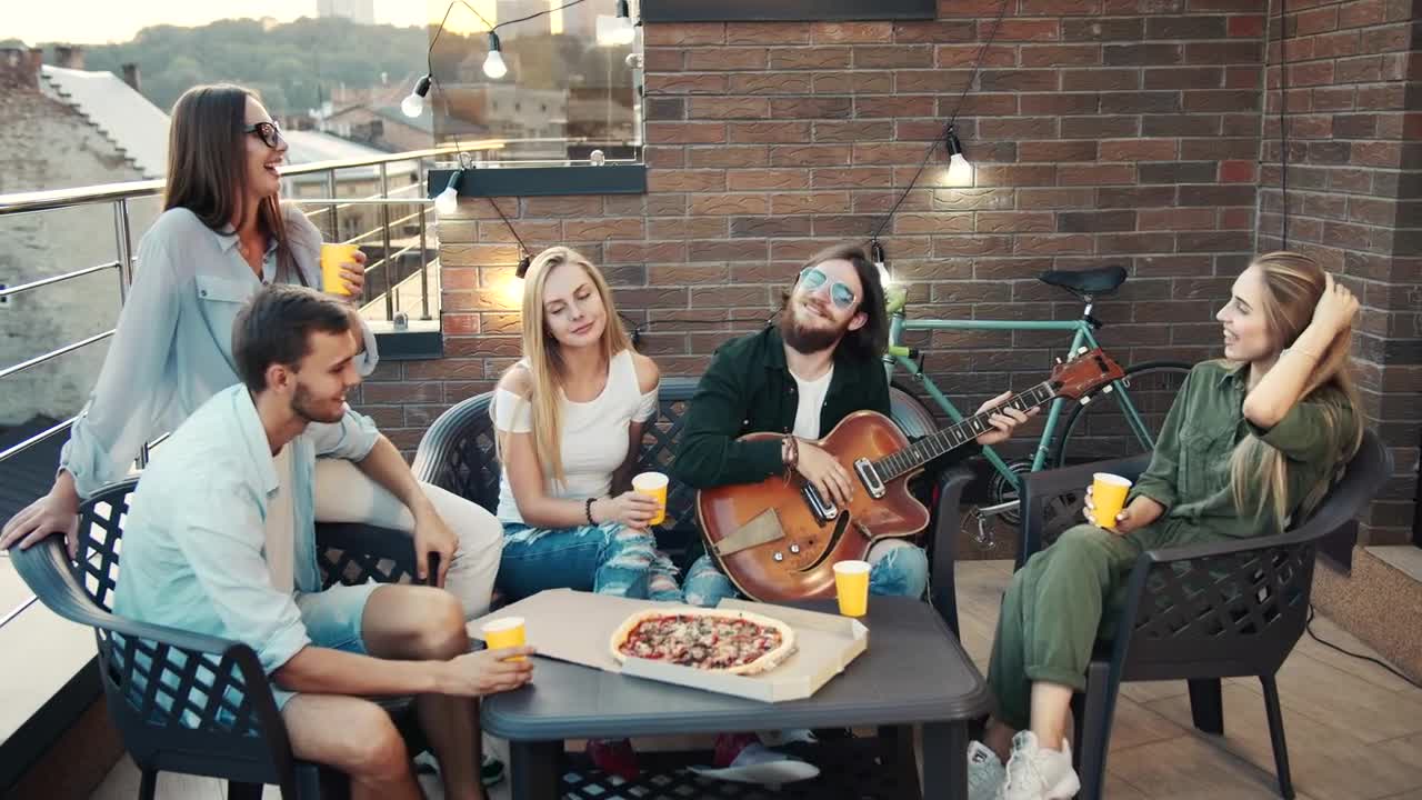Stock Video Happy Friends Spending Time Together On A Rooftop Animated Wallpaper