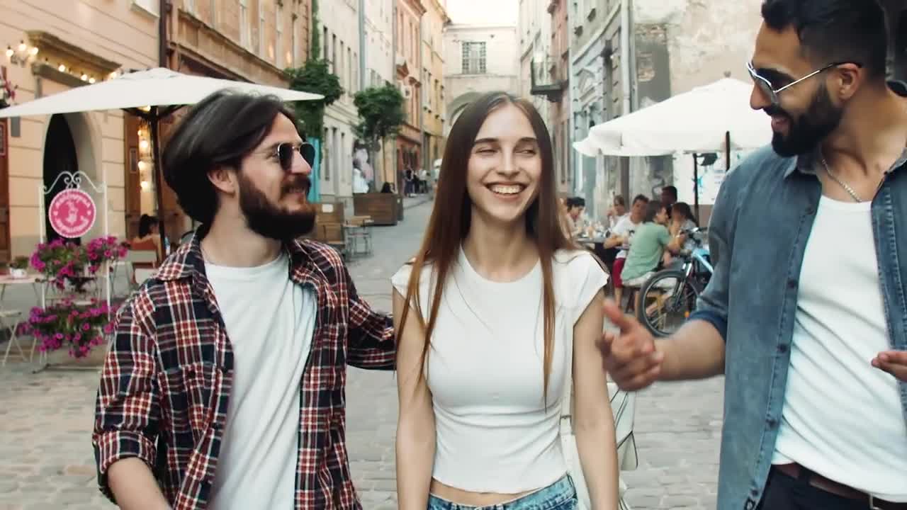 Stock Video Happy Friends Laugh And Walk Down Street Animated Wallpaper