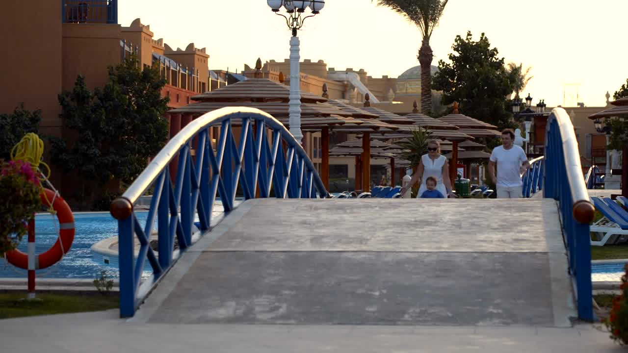 Stock Video Happy Family Running Across A Bridge Animated Wallpaper