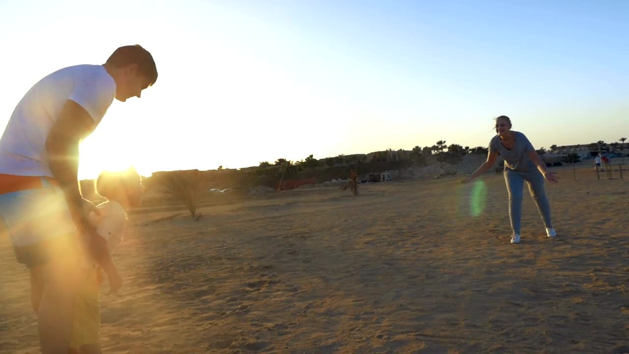 Stock Video Happy Family Playing In The Sand Animated Wallpaper