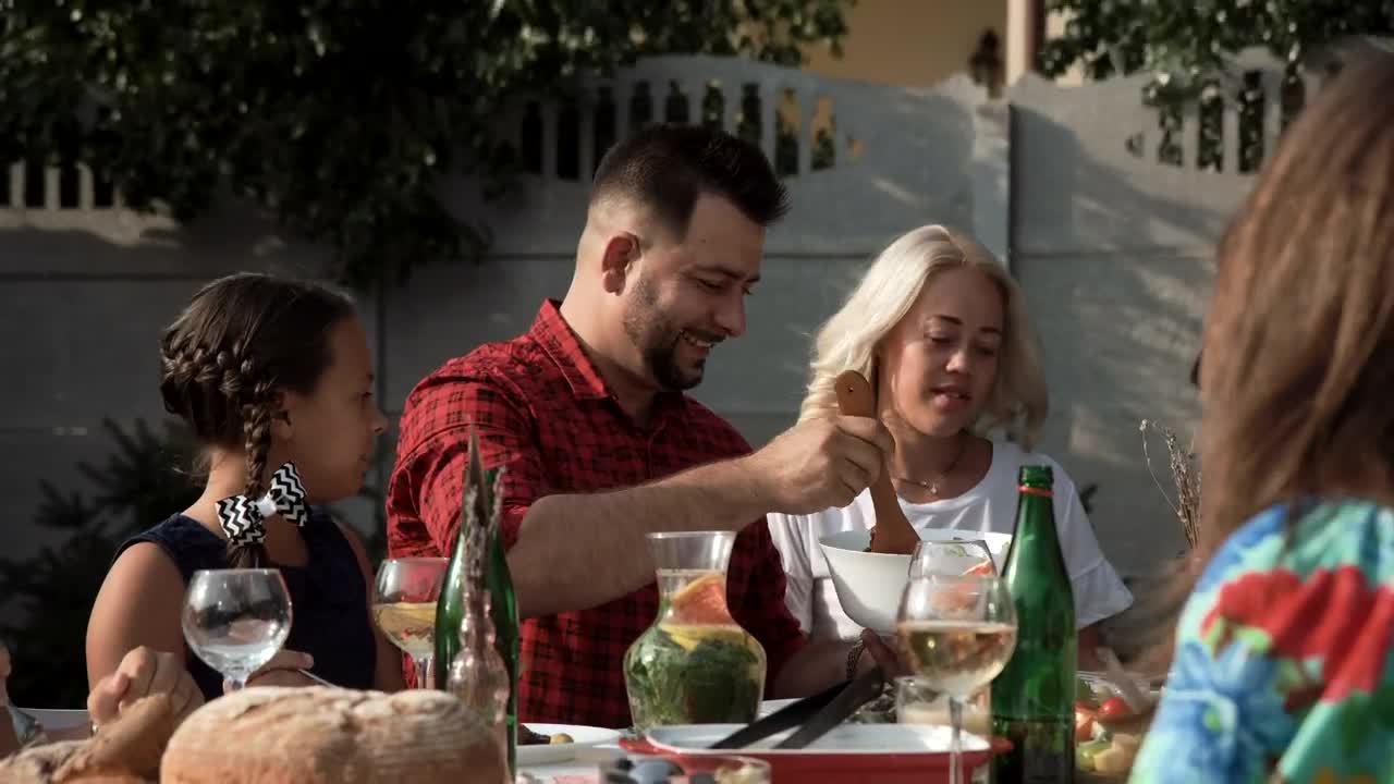 Stock Video Happy Family Eating In The Garden Animated Wallpaper