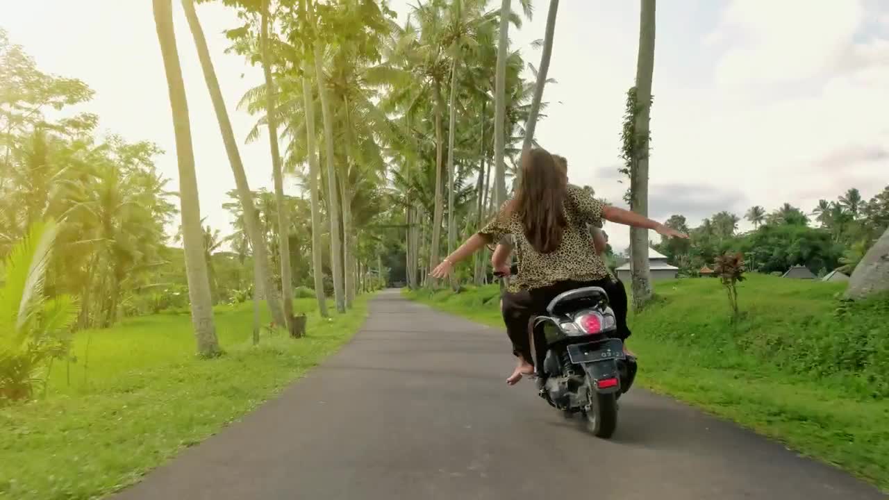 Stock Video Happy Couple In A Funny Trip On Motorcycle Animated Wallpaper