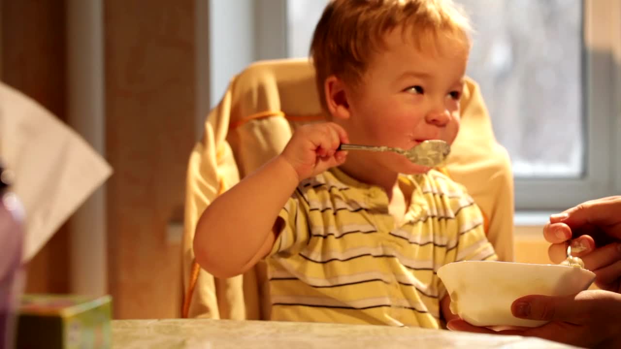 Stock Video Happy Child Eating Breakfast Animated Wallpaper
