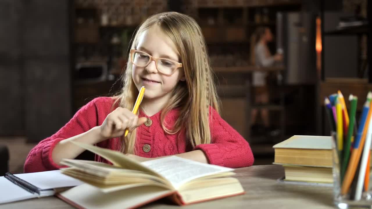 Stock Video Happy Child Doing Her Homework Animated Wallpaper