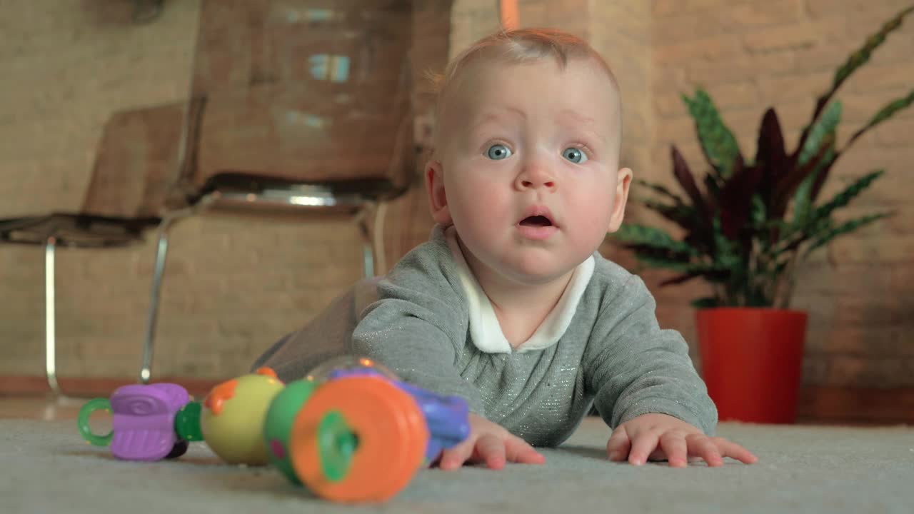 Stock Video Happy Baby Girl Laying On The Floor Animated Wallpaper