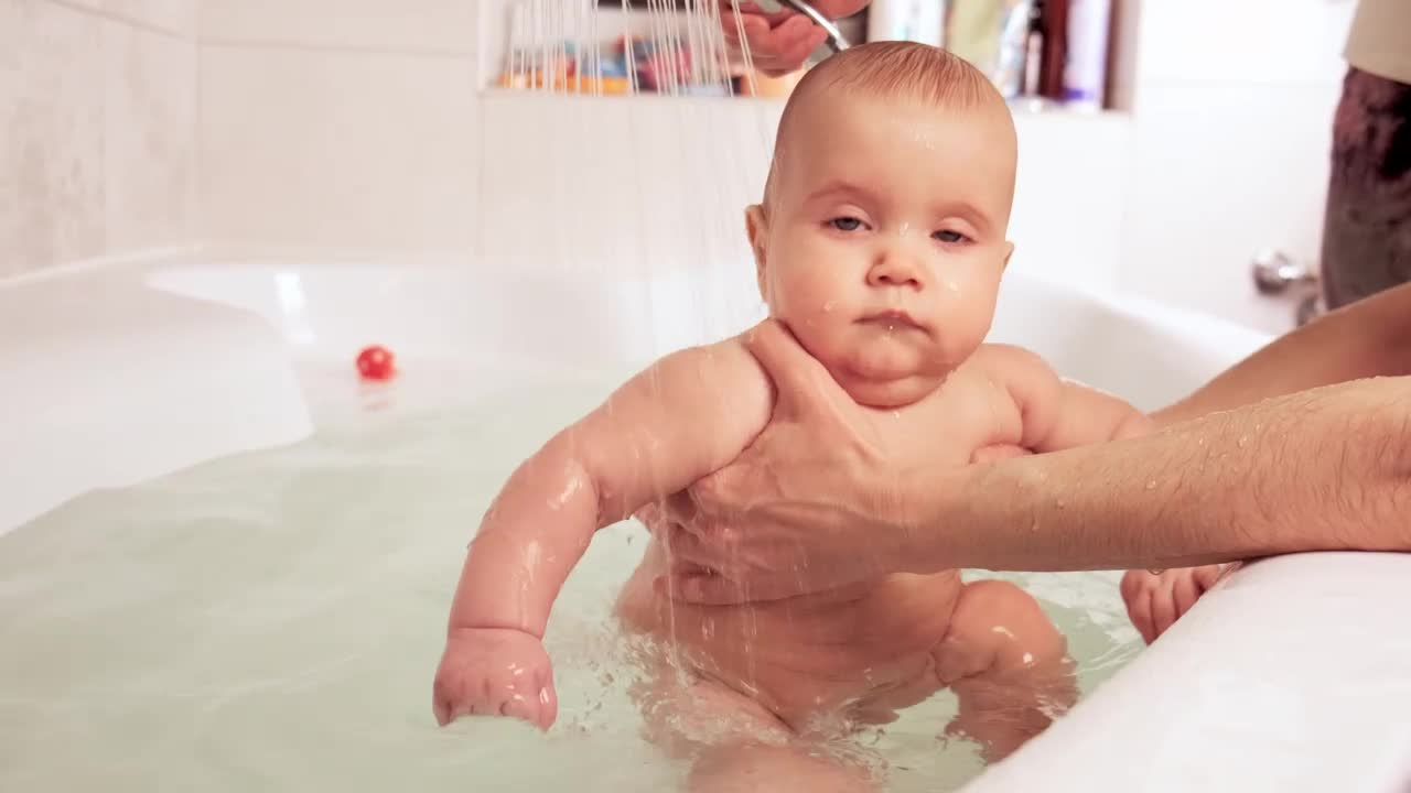 Stock Video Happy Baby Being Bathed In The Tub Animated Wallpaper