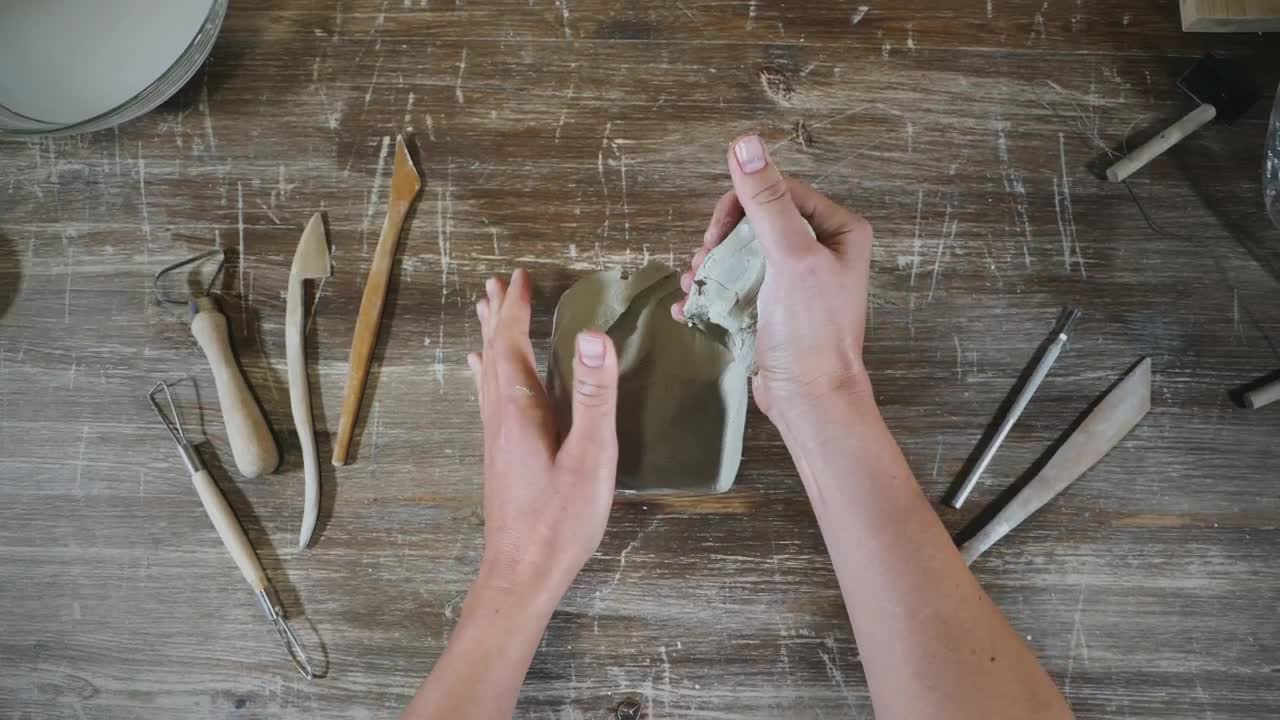 Stock Video Hans Molding Clay In The Workshop Table Animated Wallpaper