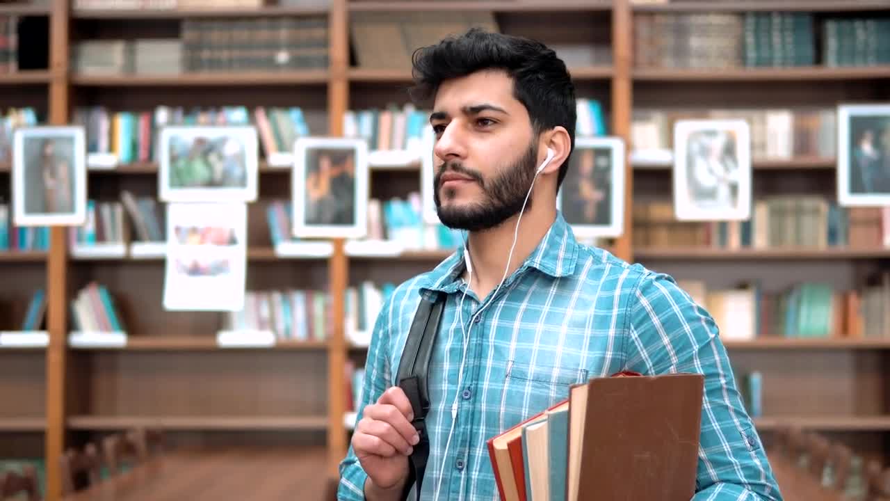 Stock Video Handsome Smiling University Student With Books Animated Wallpaper